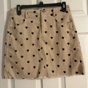 Umgee Tan Mini Skirt with Black Heart Pattern